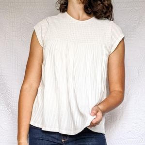 Smocked and flowy cream short sleeve blouse